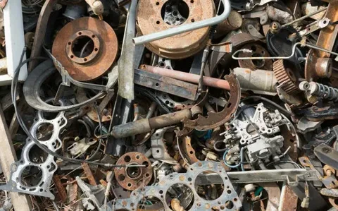 scrap metal recycling process showing sorted metal materials at recycling yard