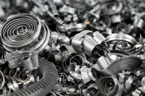Scrap metal recycling yard with copper, aluminum, and steel ready to sell