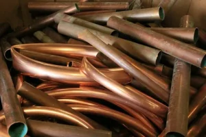 Scrap copper price NZ today showing recycled copper wire, copper pipes, and scrap metal ready for recycling in New Zealand