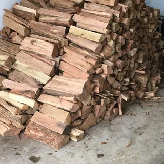 Cheap dry seasoned firewood stacked for delivery in Wanganui, ready for wood burners and home heating
