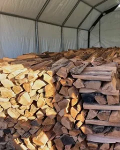 How to store delivered firewood outdoors to keep it dry in Whanganui