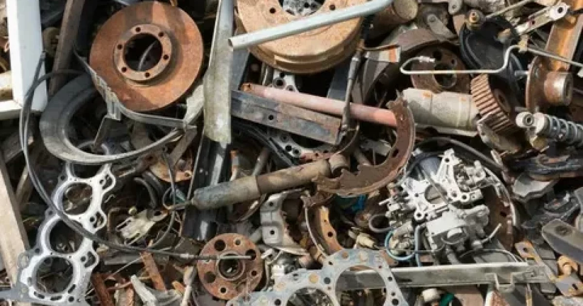 scrap metal recycling process showing sorted metal materials at recycling yard